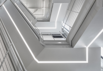 Central Staircase Takes on Sculptural Quality with Integrated Architectural Lighting