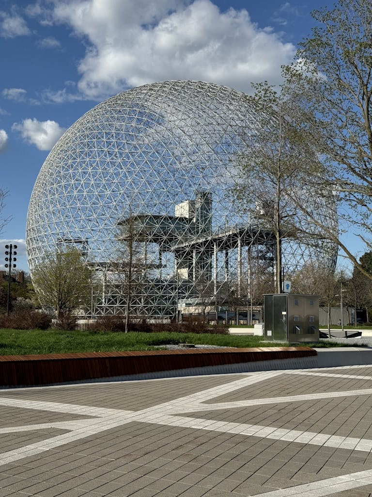 The iconic Biosphere in Montreal under a clear sky, showcasing its unique architectural design.